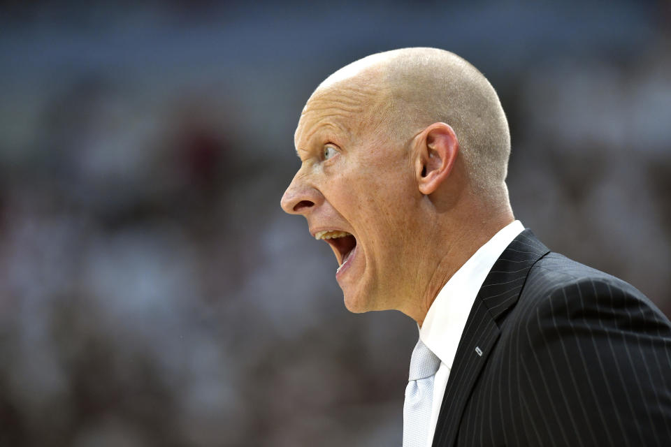 Louisville head coach Chris Mack shouts instructions to his team during the second half of an NCAA college basketball game against Michigan, in Louisville, Ky., Tuesday, Dec. 3, 2019. Louisville won 58-43. (AP Photo/Timothy D. Easley)