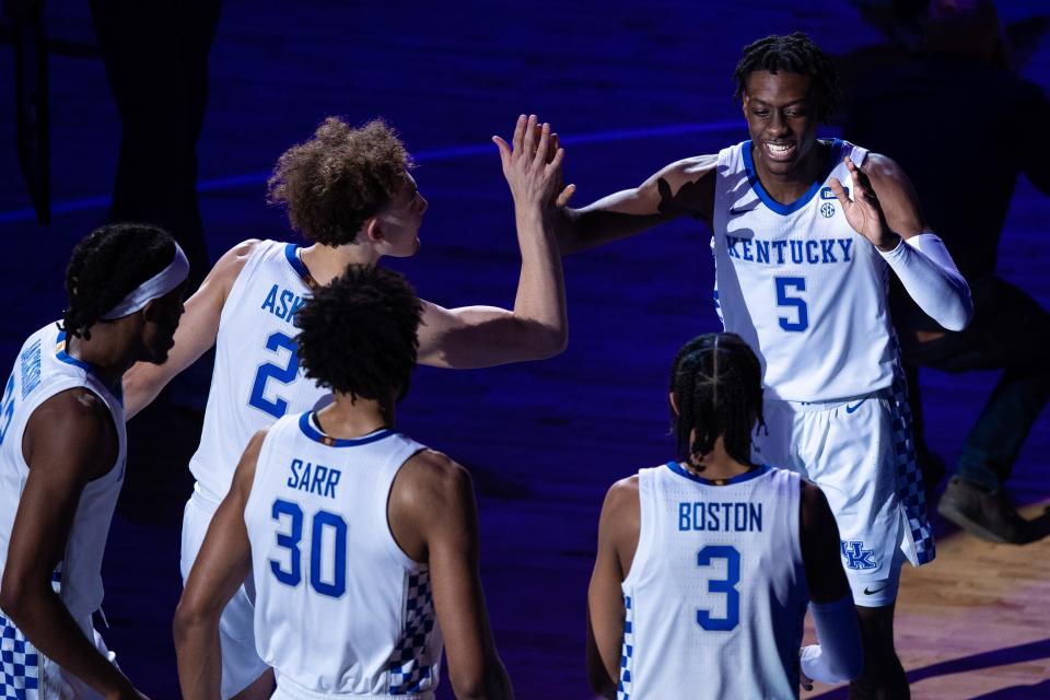 Kentucky guard Terrence Clarke (5) high fives his Kentucky teammates before a game against Morehead State.