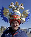 A fan makes his way to the Olympic Park for the 2014 Winter Olympics, Thursday, Feb. 13, 2014, in Sochi, Russia. (AP Photo/Morry Gash)