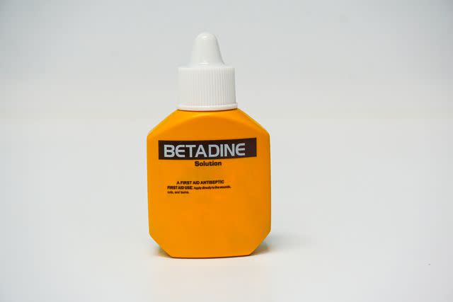 <p>Getty Images/Tonpor Kasa</p> Betadine is an important cleaning solution to have in your cat's first aid kit.