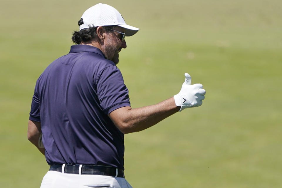 Phil Mickelson flashes a thumbs up to the gallery during a practice round ahead of the U.S. Open golf tournament, Tuesday, June 14, 2022, at The Country Club in Brookline, Mass. (AP Photo/Charles Krupa)