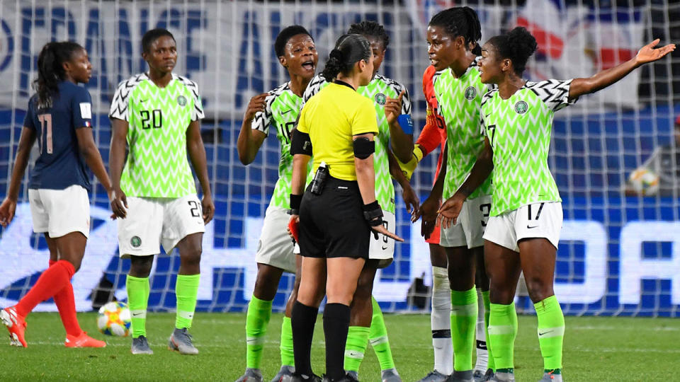 Nigeria's players react to the referee's controversial call.. (Photo by DAMIEN MEYER/AFP/Getty Images)