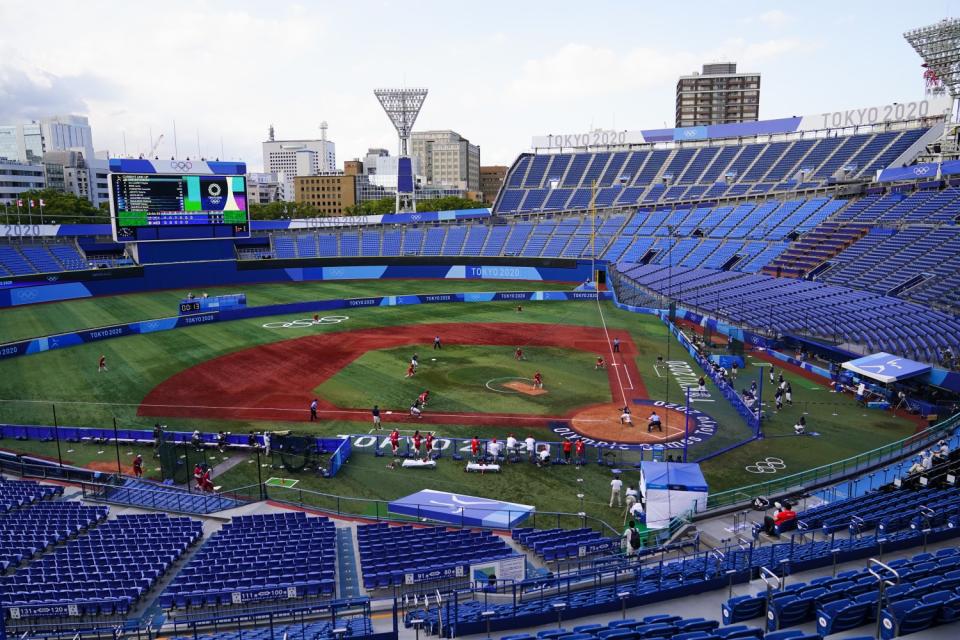 Mexico pitcher Danielle O'Toole delivers against the United States in a nearly empty stadium.