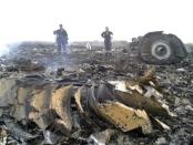 Emergencies Ministry members work at the site of a Malaysia Airlines Boeing 777 plane crash in the settlement of Grabovo in the Donetsk region, July 17, 2014.REUTERS/Maxim Zmeyev