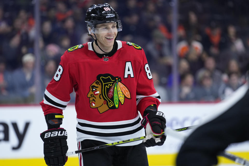 FILE - Chicago Blackhawks' Patrick Kane smiles during an NHL hockey game Jan. 19, 2023, in Philadelphia. The New York Rangers have acquired Kane in a trade with the Blackhawks. The Rangers sent a conditional second-round pick and a future fourth-rounder to Chicago and a third-rounder in 2025 to Arizona to complete the deal. Kane joins the Rangers after waiving his no-movement clause to leave the only NHL organization he has known. (AP Photo/Matt Slocum, File)