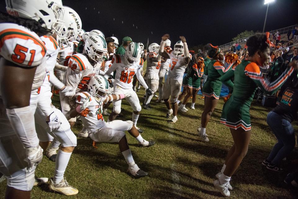 Eastside players celebrate after defeating Santa Fe for the district championship on Oct. 28 in Gainesville.