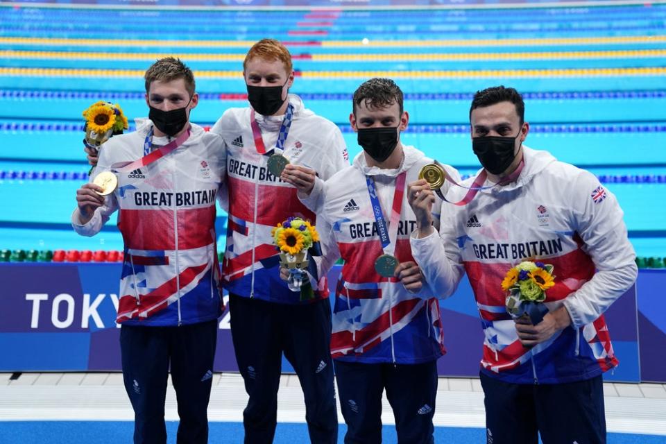 Duncan Scott, Tom Dean, Matthew Richards and James Guy after securing relay gold (Adam Davy/PA)
