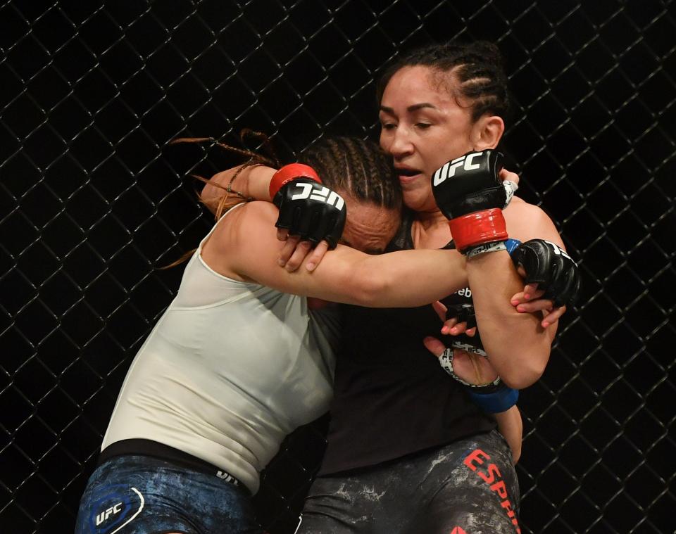 May 9, 2020; Jacksonville, Florida, USA; Carla Esparza (red gloves) fights Michelle Waterson (blue gloves) during UFC 249 at VyStar Veterans Memorial Arena. Mandatory Credit: Jasen Vinlove-USA TODAY Sports