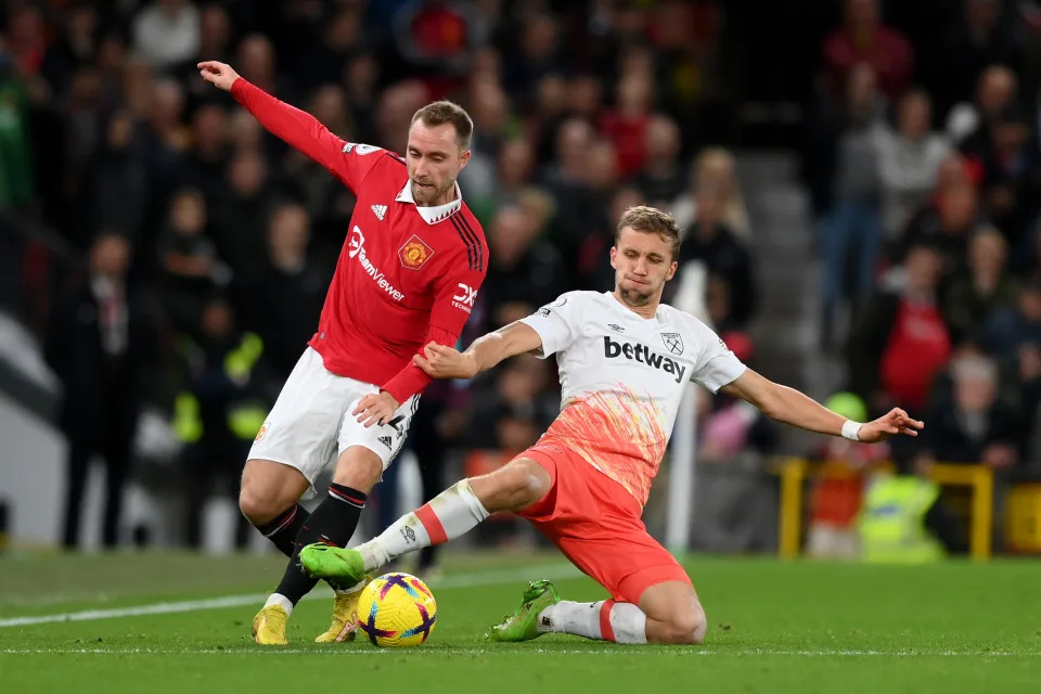 MANCHESTER, ENGLAND - OCTOBER 30: Tomas Soucek of West Ham United and Christian Eriksen of Manchester United battle for the ball during the Premier League match between Manchester United and West Ham United at Old Trafford on October 30, 2022 in Manchester, England. (Photo by Shaun Botterill/Getty Images)