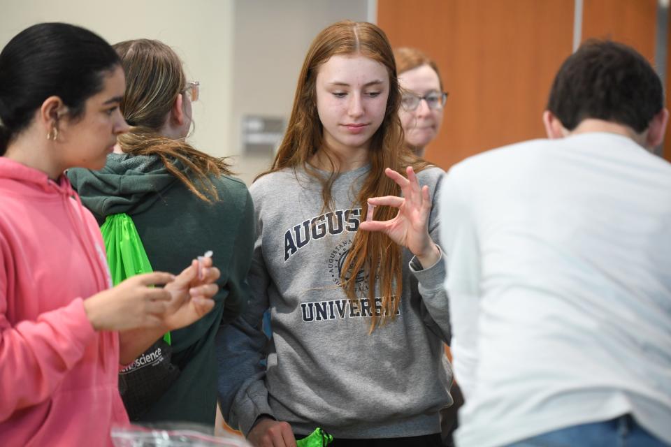 Middle school students extract DNA from plant cells at the Augustana University table on Wednesday, March 6, 2024 inside The Hub at Southeast Technical College in Sioux Falls.