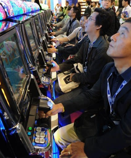 Visitors to Global Gaming Expo check out the latest gambling wares at a gaming exhibition in Macau, in 2011. Casino industry leaders have gathered in the world's gambling capital Macau once again, for the 2012 edition of Global Gaming Expo Asia, a three-day feast of gambling innovations at the glitzy Venetian hotel