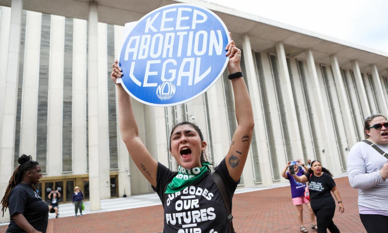 <span>Faith Halstead with other protesters and activists near the Florida state capitol, in Tallahassee, on 3 April 2023, where state senators voted to pass a proposed six-week abortion ban.</span><span>Photograph: The Washington Post/Getty Images</span>