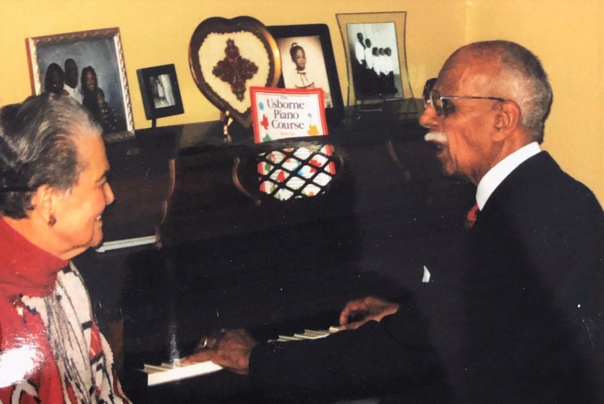 Marian and Donald Spencer share a moment at the piano.