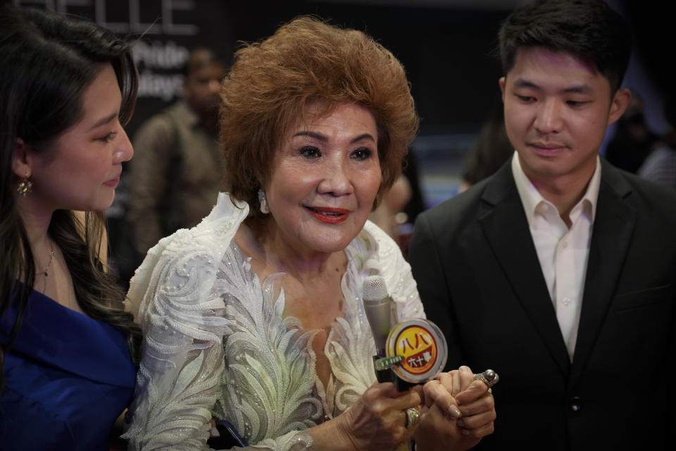 Janet Yeoh, mother of Michelle Yeoh, speaks to media members during a live view event at a cinema in Kuala Lumpur, Malaysia, Monday, March 13, 2023, as the 95th Academy Awards was held in Los Angeles. Michelle Yeoh was nominated for the best actress category. (AP Photo/Vincent Thian)