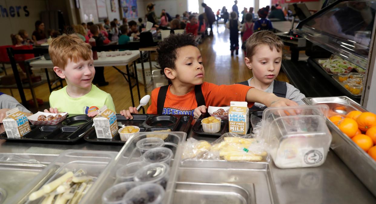 Kindergarten students at Suamico Elementary School go through the hot lunch line on March 8, 2023, in Suamico, Wis.