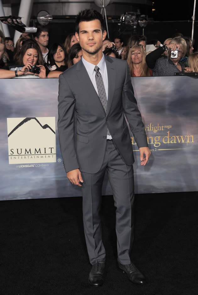 Twilight LA premiere: Taylor Lautner looked as perfect as ever in his grey suit and did some smouldering poses. Copyright [PA]