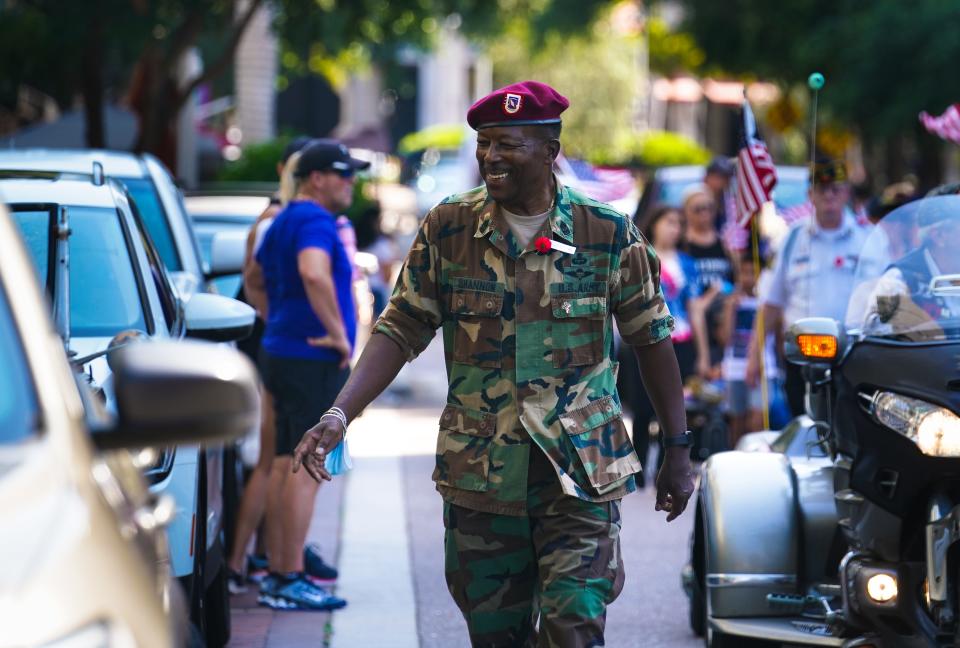 Veterans and supporters march down Main Street, in Sarasota, on Memorial Day, May 31, 2021. The city canceled its official veterans' parade last year but is hosting one this year.