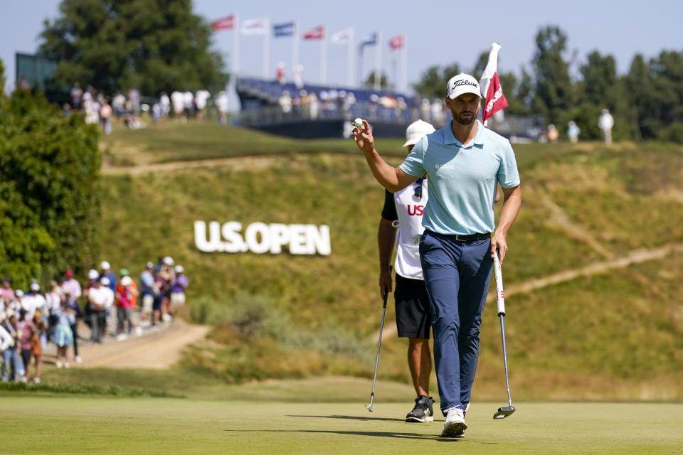 Wyndham Clark waves after his putt on the fourth hole during the final round of the U.S. Open golf tournament at Los Angeles Country Club on Sunday, June 18, 2023, in Los Angeles. (AP Photo/Marcio J. Sanchez)