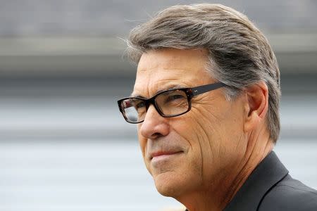 Texas Governor Rick Perry, a possible Republican candidate for the 2016 presidential race, waits to speak at a "NH GOP Victory Rally" in Stratham, New Hampshire August 23, 2014. REUTERS/Brian Snyder