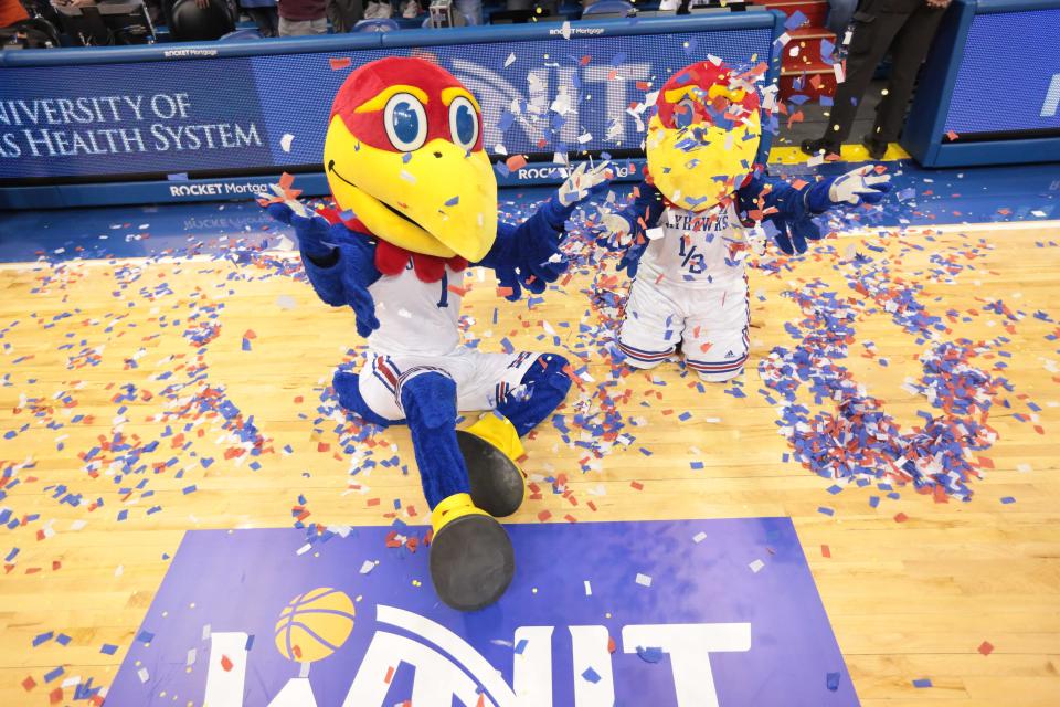 Big Jay and Baby Jay throw up confetti to celebrate their team's victory in the 2023 Postseason WNIT championship game April 1 inside Allen Fieldhouse.