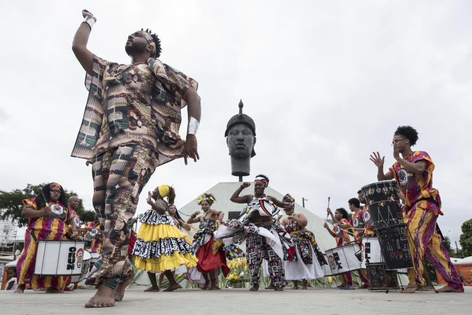 A man dances at a Black Awareness Day event in front of the monument honoring Zumbi dos Palmares, quilombo leader and symbol of the fight against slavery in Brazil, in Rio de Janeiro on Nov. 20, 2019.<span class="copyright">Barbara Dias—AGIF/AP</span>