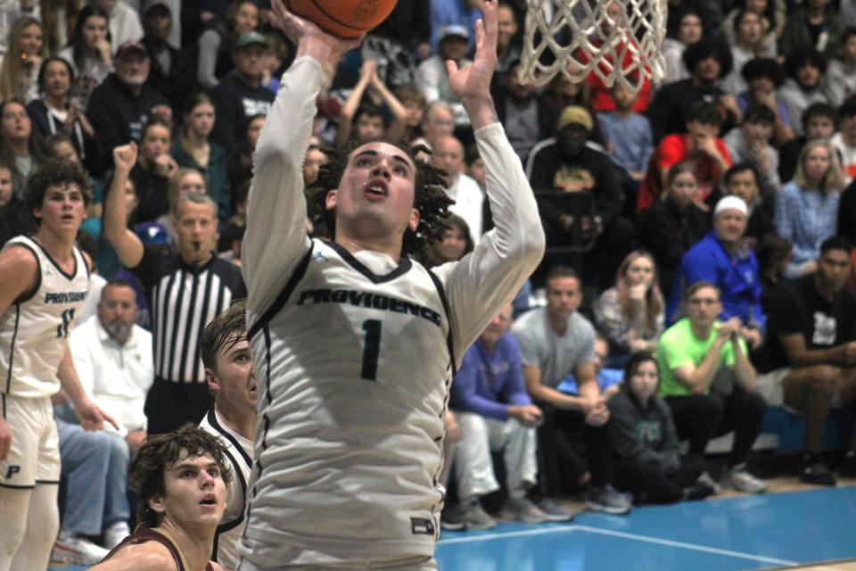 Providence guard Chris Arias goes up for a basket against Episcopal during the FHSAA Region 1-3A high school boys basketball final.