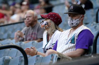 Arizona Diamondbacks fans watch prior to a baseball game against the Cincinnati Reds, Friday, April 9, 2021, in Phoenix. (AP Photo/Matt York)