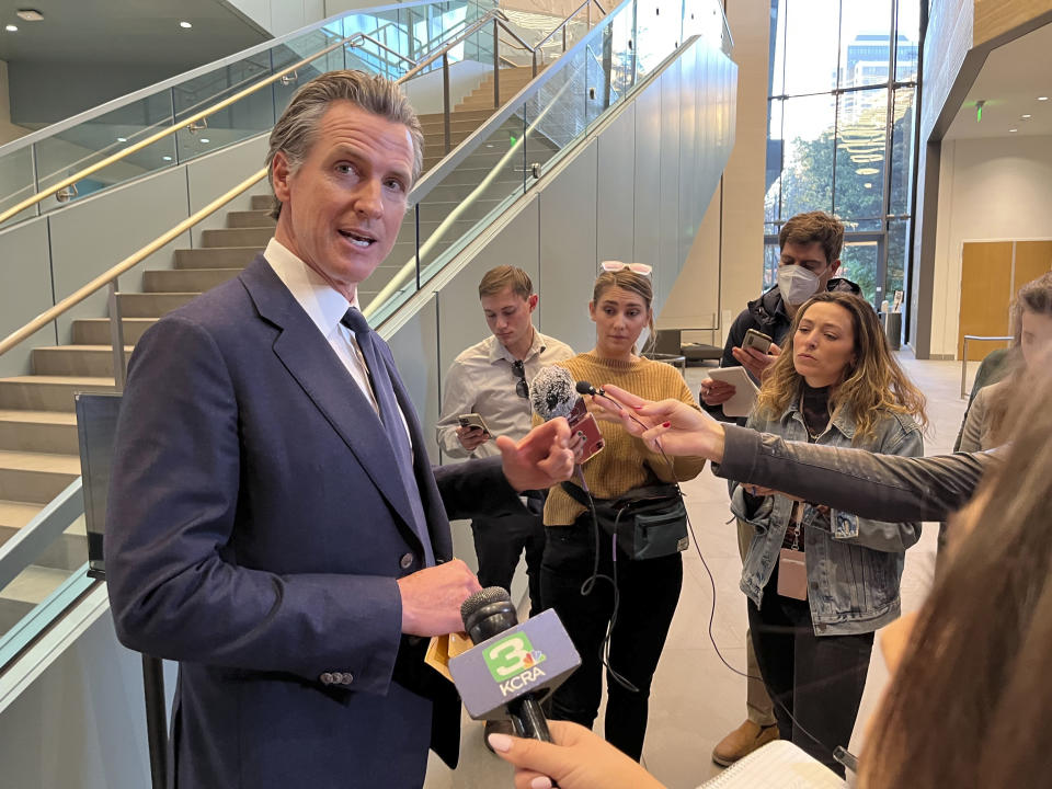 California Gov. Gavin Newsom talks to reporters in Sacramento, Calif., Friday, Nov. 18, 2022. Newsom has agreed to release $1 billion in state homelessness funding he testily put on pause earlier in the month. But his office says he will do so only if local governments agree to step up the aggressiveness of their plans going forward to reduce homelessness. (AP Photo/Janie Har)