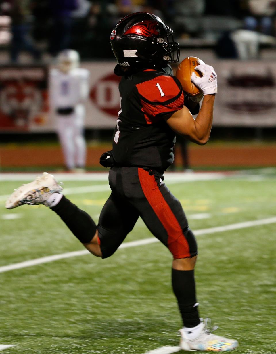 Ian Ngugi, of Lamar, catches the ball during the Tigers 35-7 win over Fair Grove in the district championship game at Lamar High School on Friday, Nov. 13, 2021.