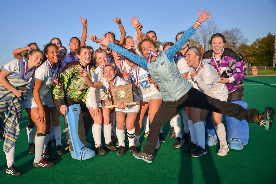 South Burlington head coach, Anjie Soucy celebrates with her team at the conclusion of the D1 field hockey championship between the Wolves and the Bellows Falls Terriers on Saturday afternoon at UVM's Moulton Winder Field