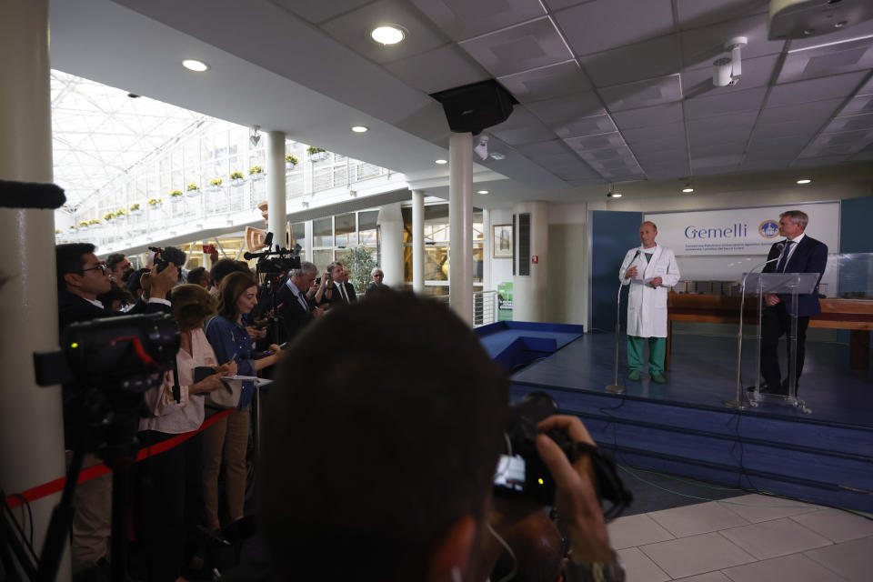 Surgeon Sergio Alfieri, left, speaks to reporters about Pope Francis' health conditions after operating on him at Rome's Agostino Gemelli University Polyclinic, Wednesday, June 7, 2023. Pope Francis underwent surgery Wednesday to repair a hernia in his abdominal wall, the latest malady to befall the 86-year-old pontiff who had part of his colon removed two years ago. At right, Pope's spokesperson Matteo Bruni.(AP Photo/Riccardo De Luca)