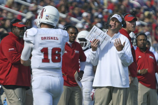 Florida Atlantic head coach Lane Kiffin speaks to his players during the first half of the Conference USA championship NCAA college football game against North Texas, Saturday, Dec. 2, 2017, in Boca Raton, Fla. (Jim Rassol/South Florida Sun-Sentinel via AP)