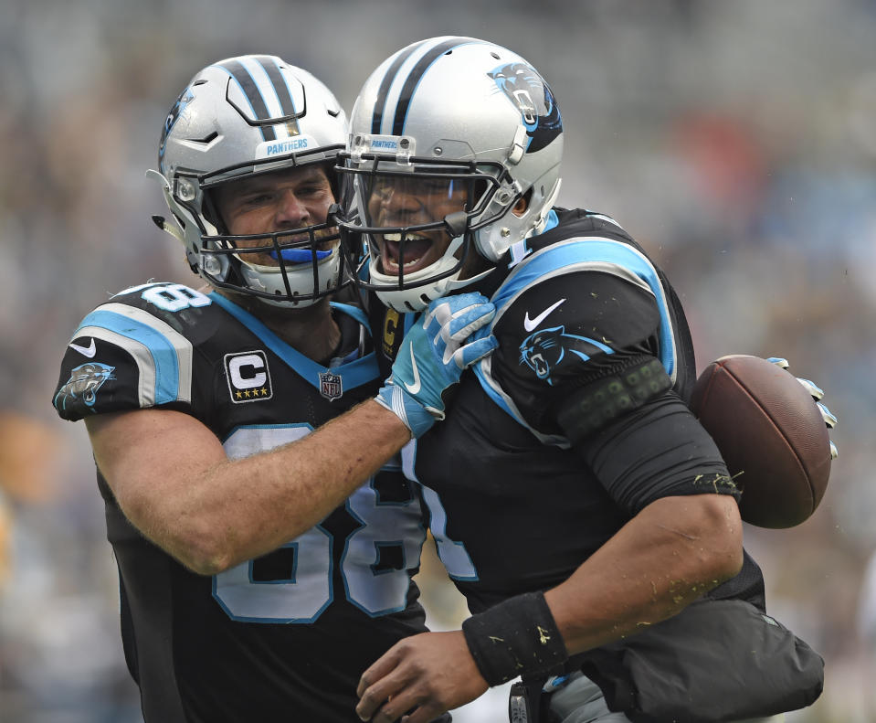 If all goes to plan, Greg Olsen and Cam Newton should be celebrating a lot this season. (AP Photo/Mike McCarn)