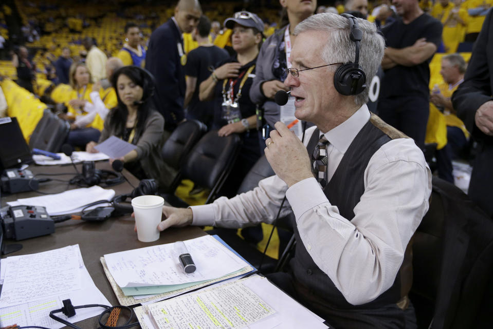 FILE - Mike Breen, NBA play-by-play sports commentator for ABC, prepares for Game 1 of basketball's NBA Finals between the Golden State Warriors and Cleveland Cavaliers on June 4, 2015, in Oakland, Calif. Breen will hit his 100th NBA Finals broadcast on Monday night, June 12, 2023, during game 5 between the Miami Heat and Denver Nuggets. (AP Photo/Ben Margot, File)