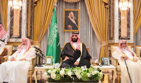 FILE PHOTO: Saudi Arabia's Crown Prince Mohammed bin Salman sits during an allegiance pledging ceremony in Mecca, Saudi Arabia June 21, 2017. Bandar Algaloud/Courtesy of Saudi Royal Court/Handout via REUTERS/File Photo