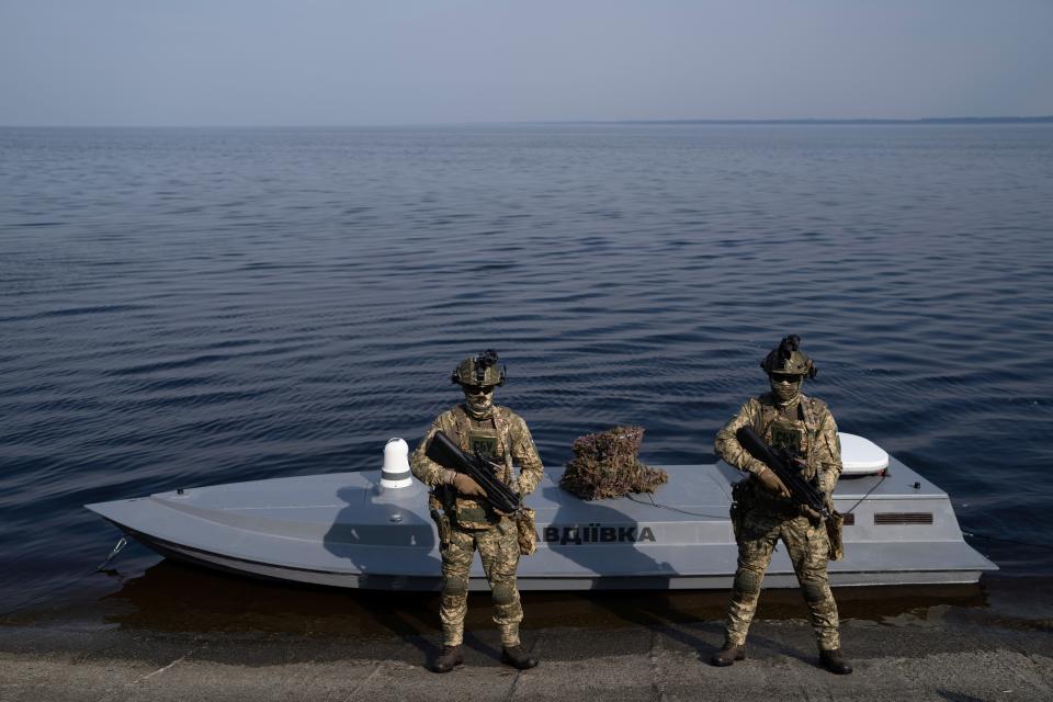 Ukrainian servicemen stand in front of a new released Sea Baby drone "Avdiivka" during the presentation by Ukraine's Security Service in the Kyiv region on March 5, 2024.