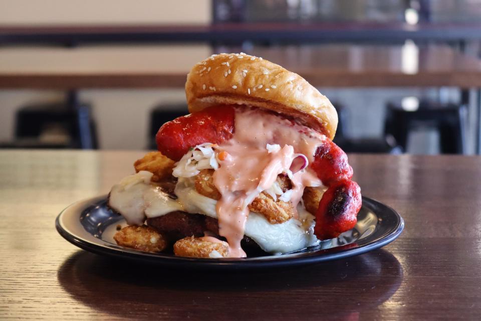 The Day One Dic-Tater from Zombie Burger in the East Village features Flamin’ Hot Cheeto orange kielbasa sausage, Jack cheese, tater rounds, house-made sauerkraut, and Russian dressing. It's available on Jan. 15.