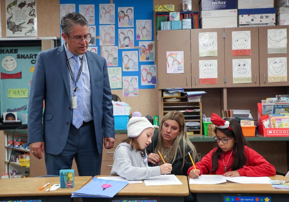 Palm Springs Unified School District superintendent Tony Signoret observes Rio Vista Elementary students learning with assistant principal Taryn Sall in a second grade classroom at Landau Elementary School in Cathedral City, Calif., Dec. 12, 2023.