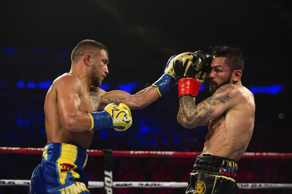 Vasiliy Lomachenko got the better of Jorge Linares on May 12 at Madison Square Garden in New York despite suffering a shoulder injury early in the fight. (AP Photo)