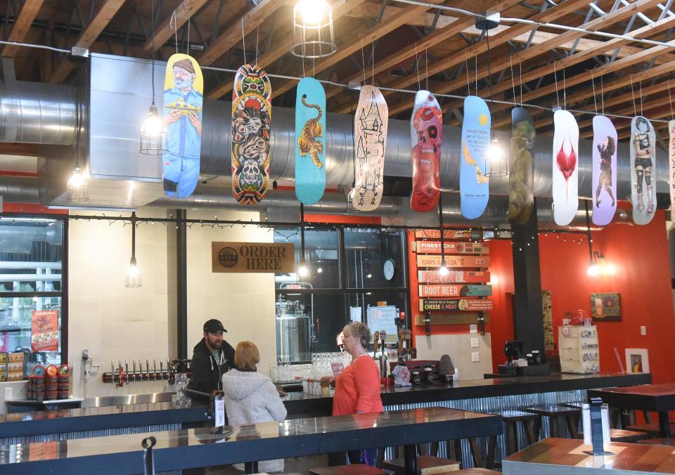 Skateboards hang from the rafters at Bad Habit Brewery in St. Joseph Wednesday, May 25, 2022. The boards are being auctioned off to raise money for the Skate Unity fundraiser.