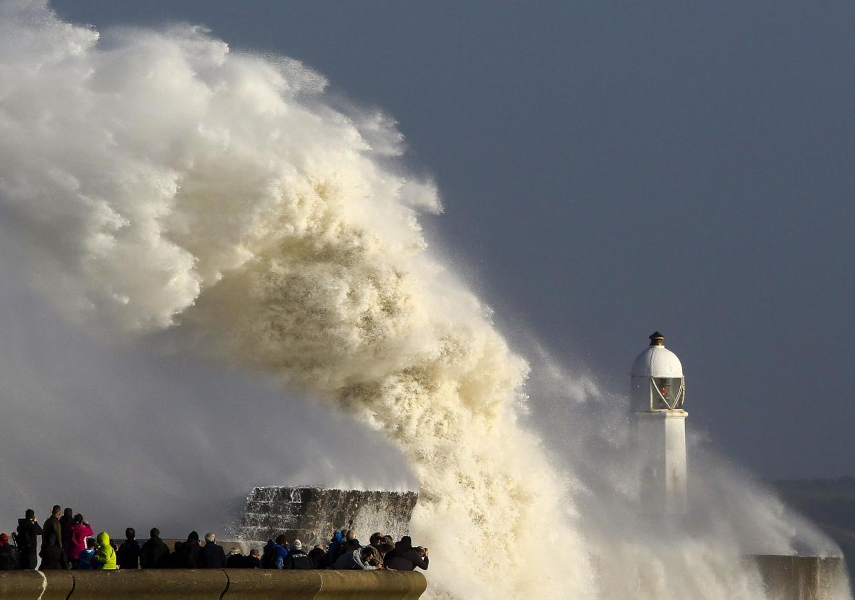 Huge waves strike the harbour wall and lighthouse at Porthcawl, south Wales, on Tuesday as Storm Ophelia arrives in the UK: AFP/Getty Images