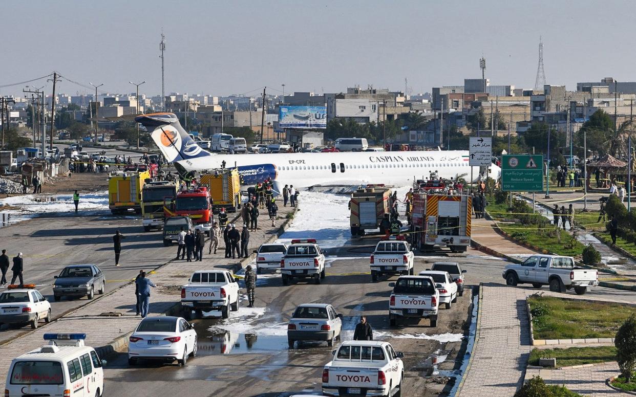 Caspian Airlines aircraft which landed on a highway after it overshot the highway during its approach in in Iran's southwestern city of Bandar-e Mahshahr - AFP