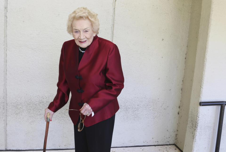 FILE - Native Hawaiian heiress Abigail Kawānanakoa poses outside a Honolulu courthouse on Oct. 25, 2019. Kawānanakoa, the so-called last Hawaiian princess whose lineage included the royal family that once ruled the islands and an Irish businessman who became one of Hawaii's largest landowners, died on Dec. 11, 2022. She was 96. Kawānanakoa's casket is set to go on public display Sunday, Jan. 22, 2023, in the downtown Honolulu palace that benefited from her wealth. (AP Photo/Jennifer Sinco Kelleher, File)