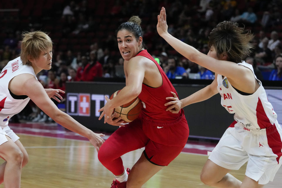 Canada's Kia Nurse attempts to get past the Japan defense during their game at the women's Basketball World Cup in Sydney, Australia, Sunday, Sept. 25, 2022. (AP Photo/Mark Baker)