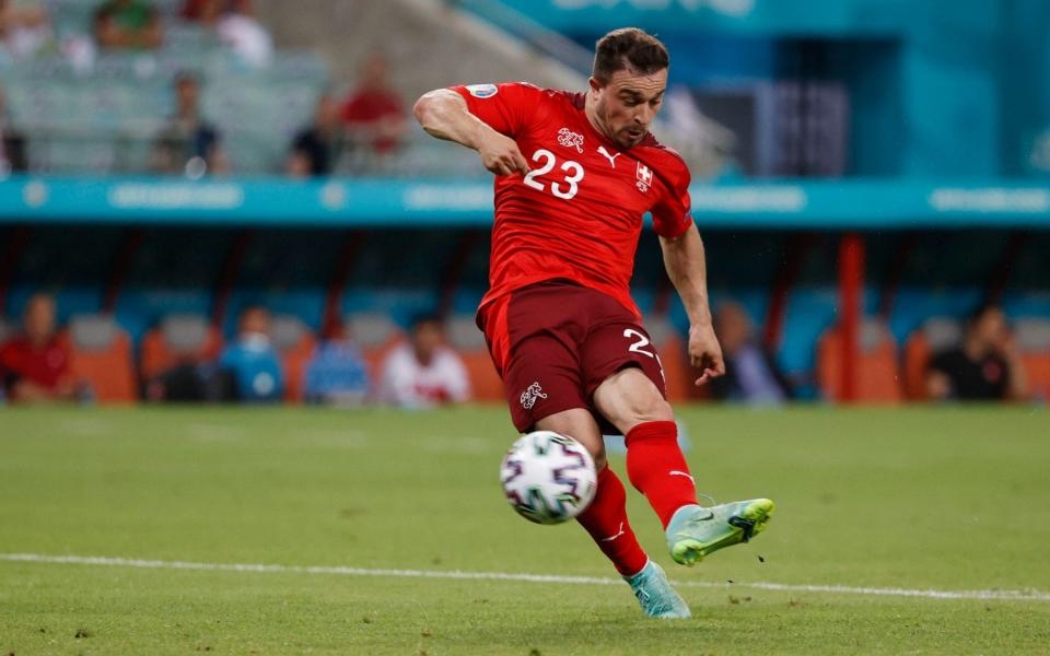 Switzerland's Xherdan Shaqiri scores their third goal - REUTERS/Valentyn Ogirenko