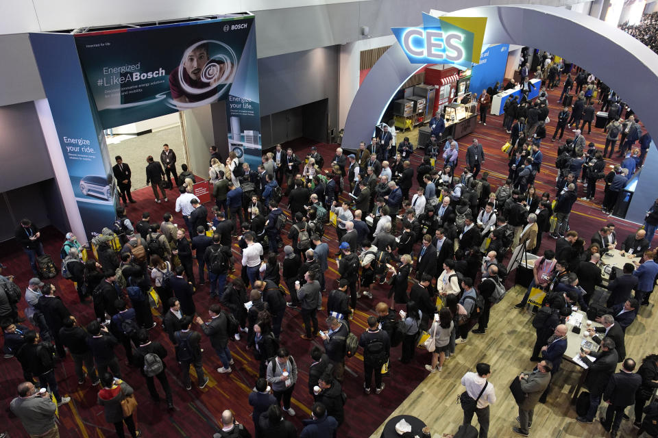 People wait to enter the show floor before the start of the CES tech show Tuesday, Jan. 9, 2024, in Las Vegas. (AP Photo/John Locher)