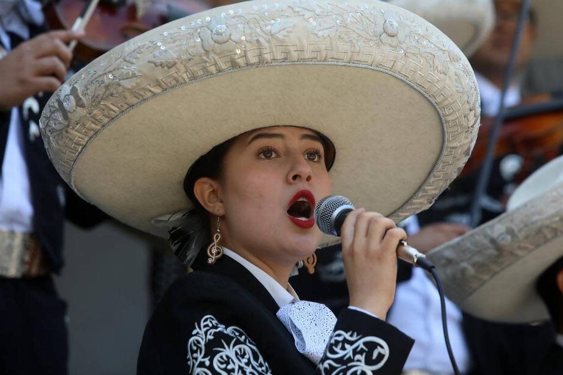 Mariachi Juvenil Colotlán violinist Sydney Raygoza sings ‘La Caponera’ during the Memorial Day ceremony at Courthouse Park in Madera on May 29, 2023.