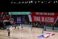 Portland Trail Blazers' Damian Lillard (0) shoots a free throw during the second half of an NBA basketball game against the Memphis Grizzlies, Friday, July 31, 2020, in Lake Buena Vista, Fla. (Mike Ehrmann/Pool Photo via AP)