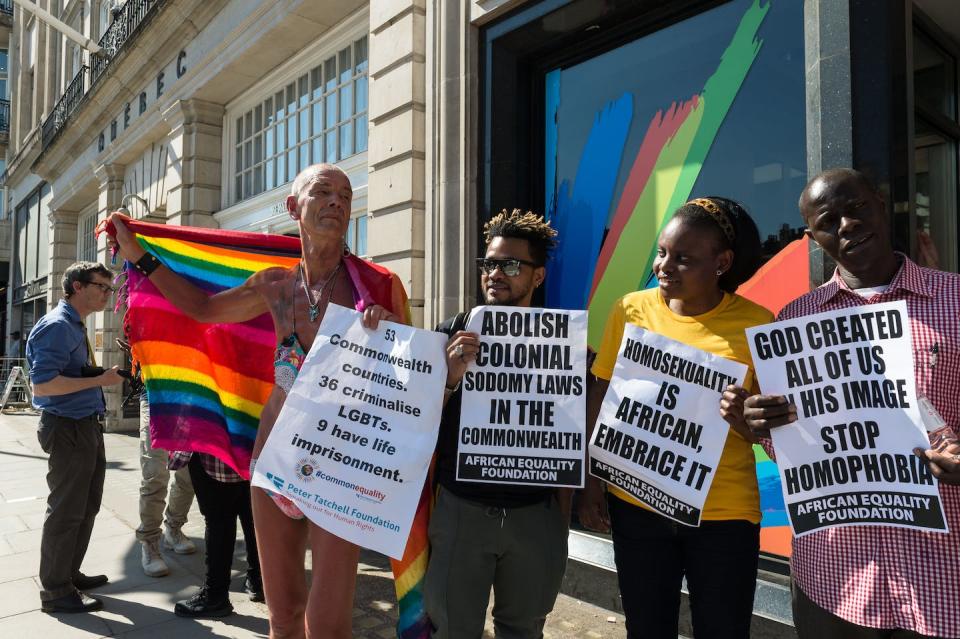 Activists and campaigners stage a protest outside the Commonwealth headquarters in central London against discrimination and criminalization of LGBTQ+ people across Commonwealth member countries. <a href="https://www.gettyimages.co.uk/detail/news-photo/activists-and-campaigners-stage-a-protest-outside-the-news-photo/948726170?adppopup=true" rel="nofollow noopener" target="_blank" data-ylk="slk:Wiktor Szymanowicz/Future Publishing via Getty Images;elm:context_link;itc:0;sec:content-canvas" class="link ">Wiktor Szymanowicz/Future Publishing via Getty Images</a>