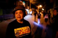 Maria Oqueria, 64, a member of a volunteer group of women patrollers, is photographed while on duty in Pateros